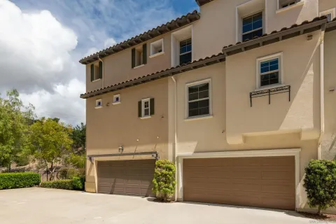 a front view of a house with garage