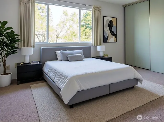 a bedroom with a bed and window