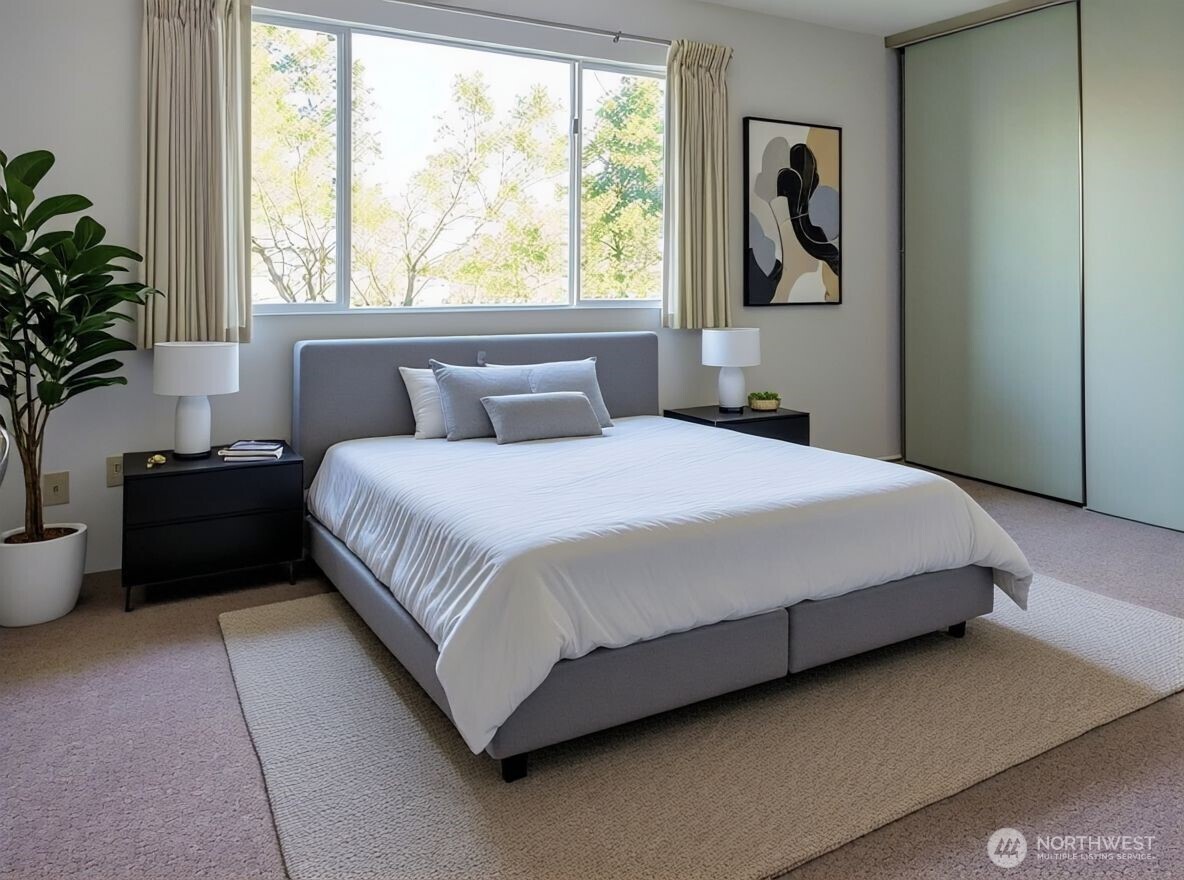 8848 Interlake Avenue North Seattle, WA 98103 - Photo 14 of 25 a bedroom with a bed and a large window