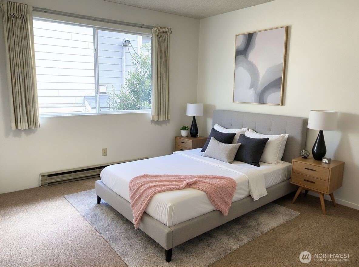 8848 Interlake Avenue North Seattle, WA 98103 - Photo 17 of 25 a bedroom with a bed and window