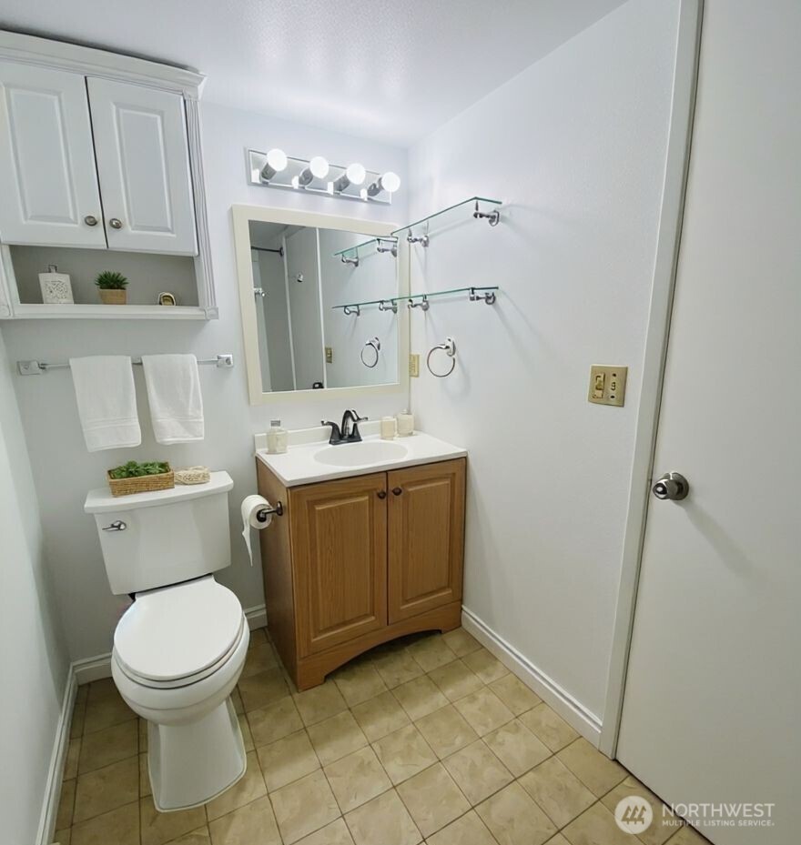 8848 Interlake Avenue North Seattle, WA 98103 - Photo 21 of 25 a bathroom with a sink a toilet and shower