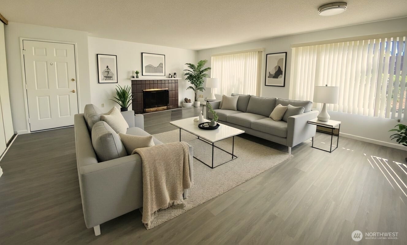 8848 Interlake Avenue North Seattle, WA 98103 - Photo 4 of 25 a living room with furniture and a fireplace