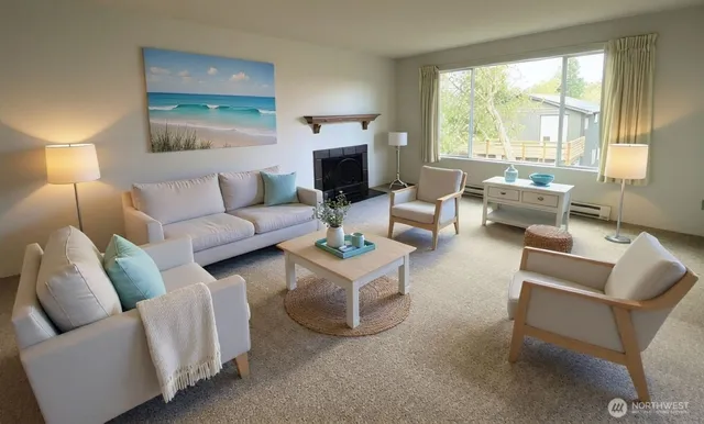 a living room with furniture and a large window