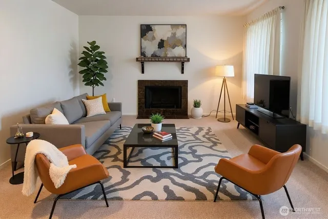 a living room with furniture and a fireplace