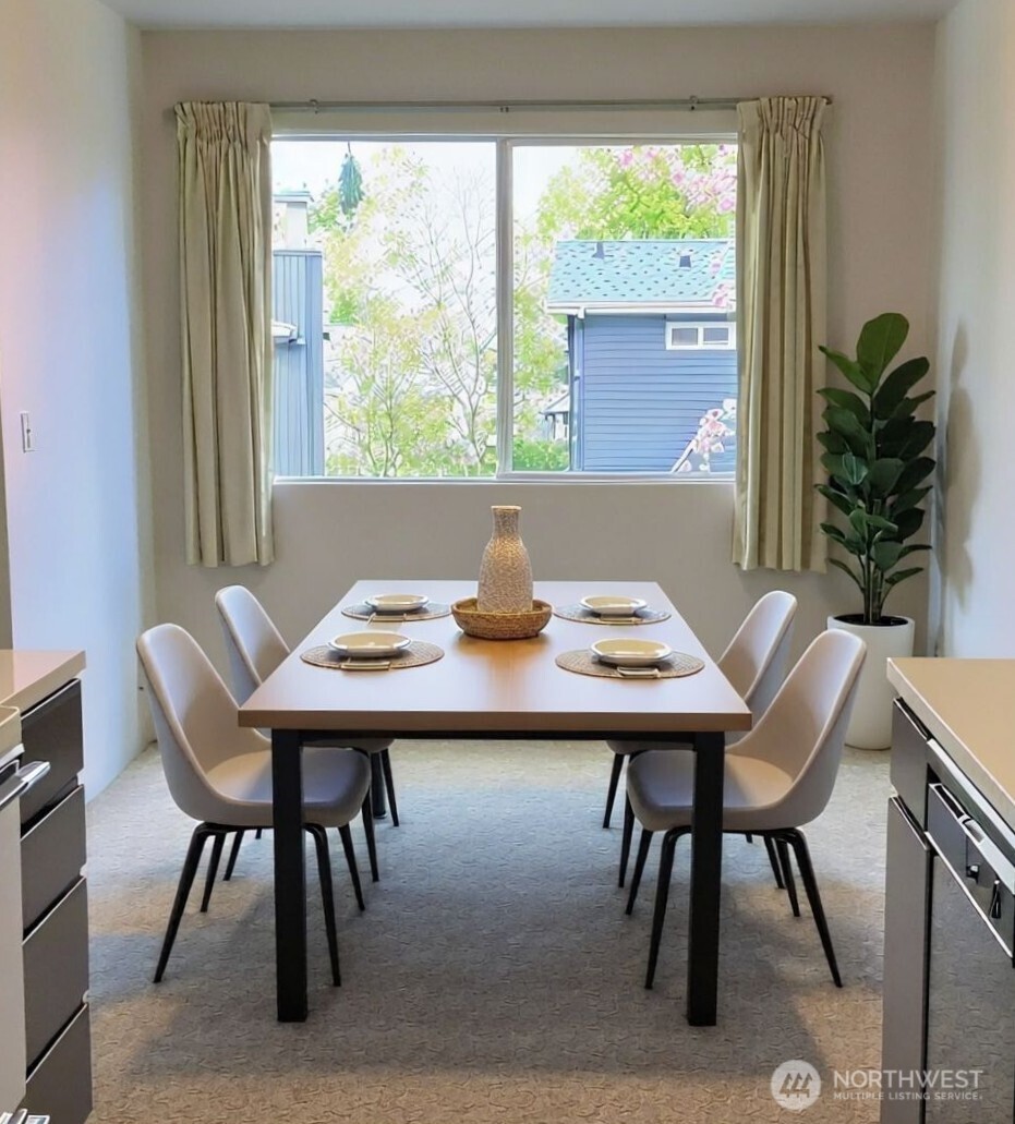 8848 Interlake Avenue North Seattle, WA 98103 - Photo 8 of 25 a view of a dining room with tables and chairs