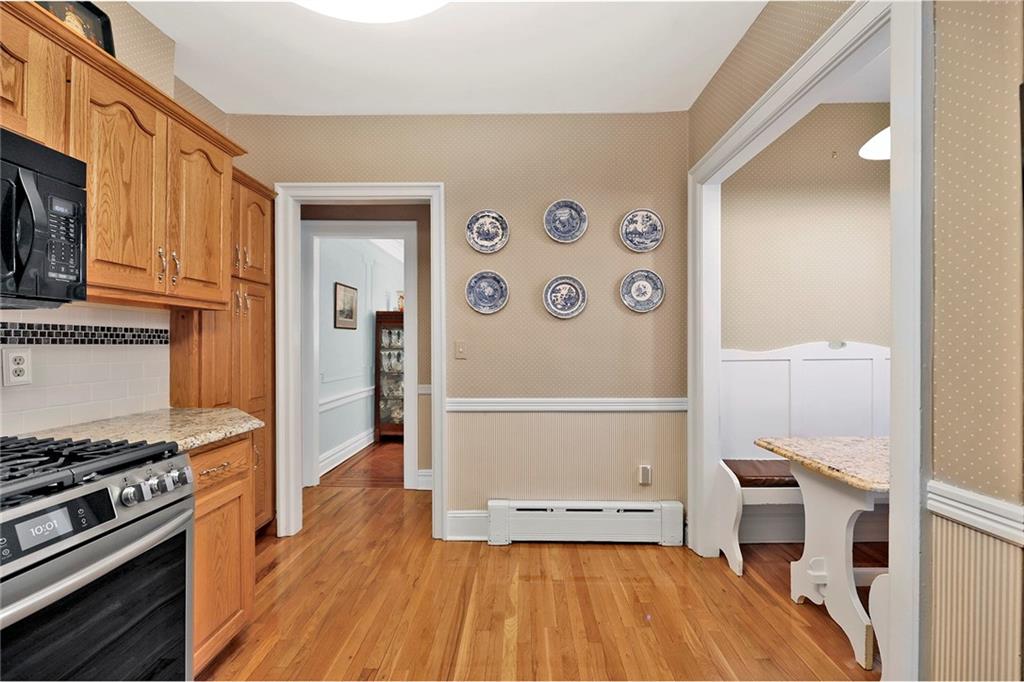 7607 Colonial Road Brooklyn, NY 11209 - Photo 7 of 35 a kitchen with a refrigerator and a stove top oven