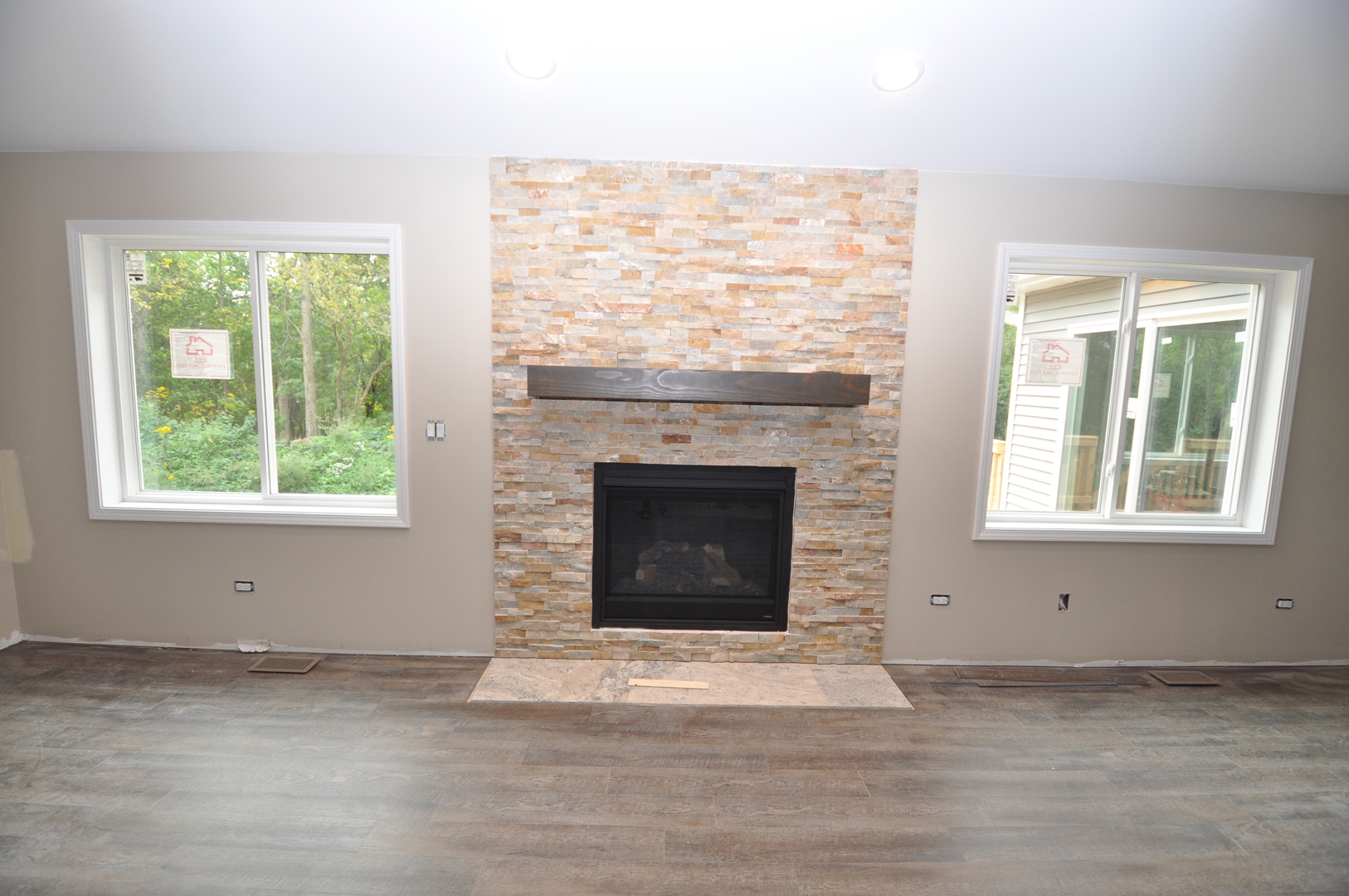 26369 Park Place Antioch, IL 60002 - Photo 11 of 24 a view of an empty room with a fireplace and a window