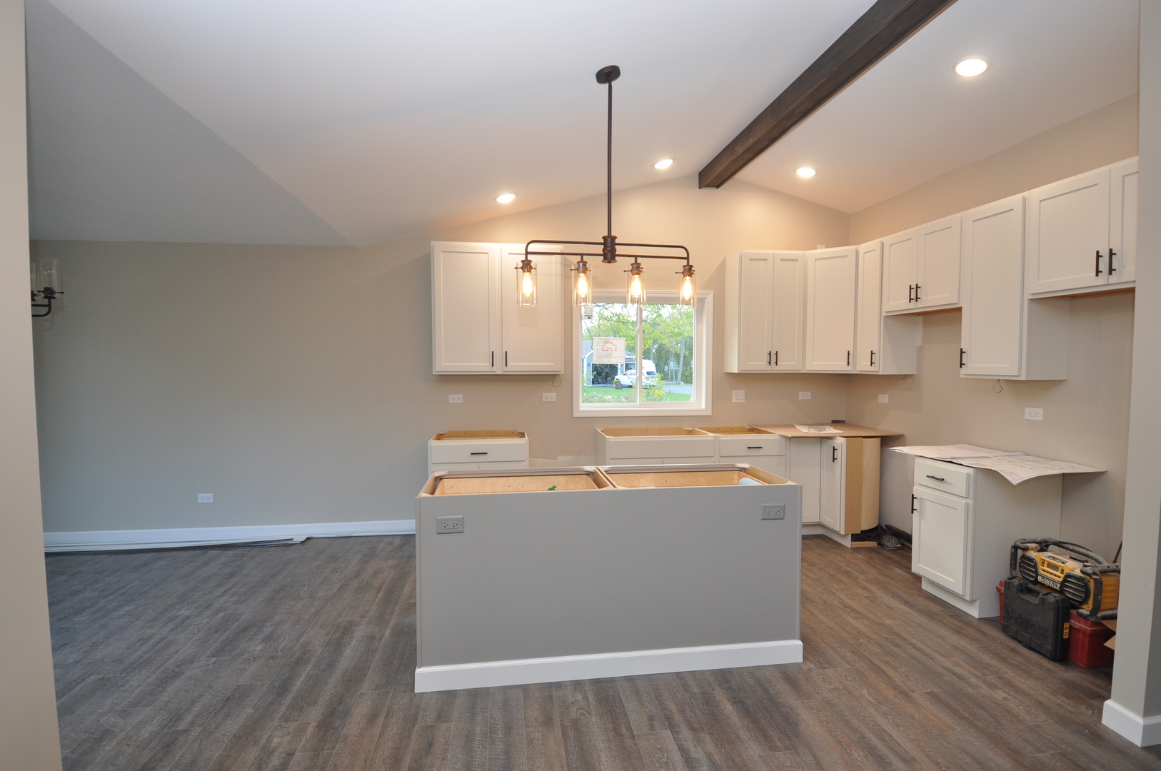 26369 Park Place Antioch, IL 60002 - Photo 12 of 24 a kitchen with stainless steel appliances a stove a sink a refrigerator wooden floor and cabinets
