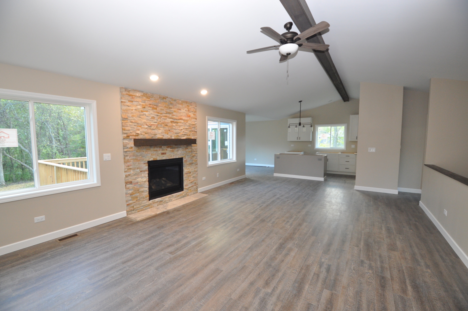 26369 Park Place Antioch, IL 60002 - Photo 10 of 24 an empty room with windows fireplace and a window