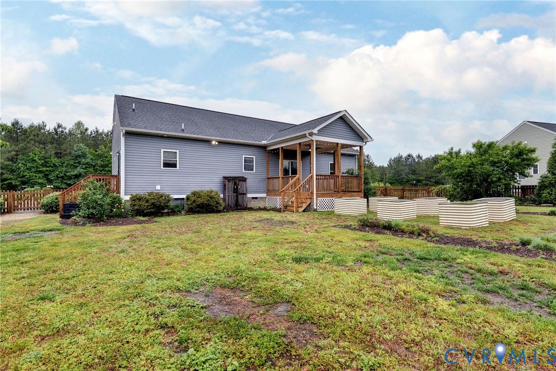 8904 Rock Cedar Road New Kent, VA 23124 - Photo 33 of 37 a front view of house with yard and trees in the background