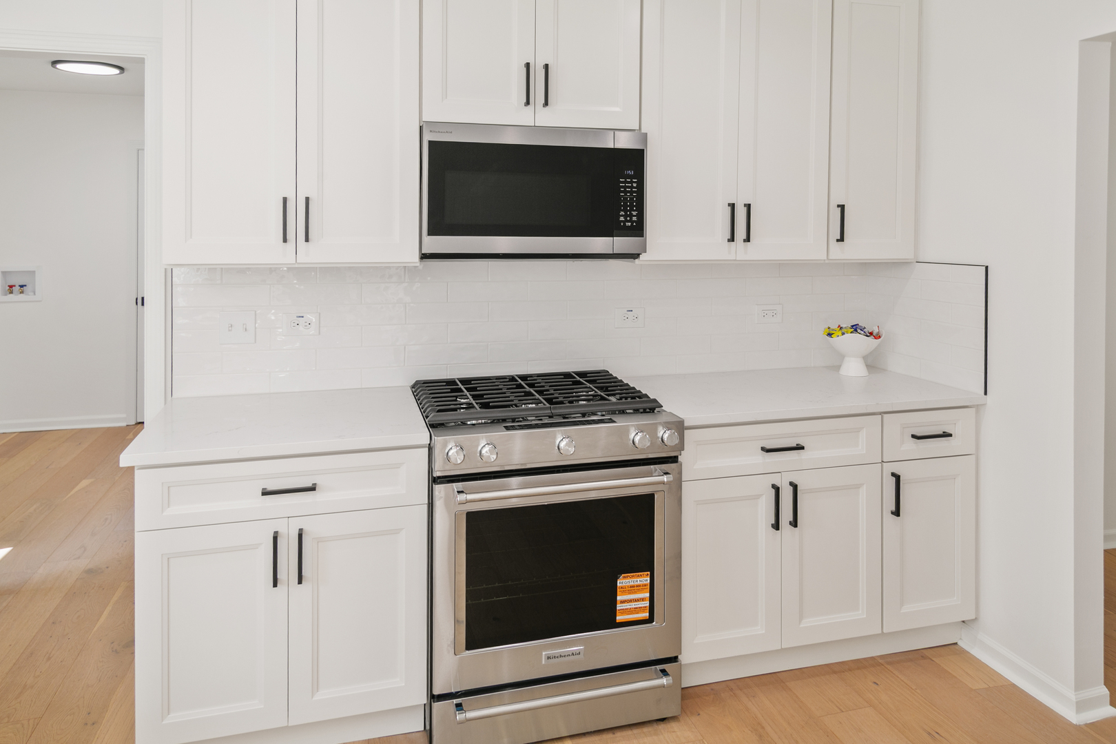 185 Cold Spring Road Barrington, IL 60010 - Photo 12 of 40 a kitchen with white cabinets and stainless steel appliances