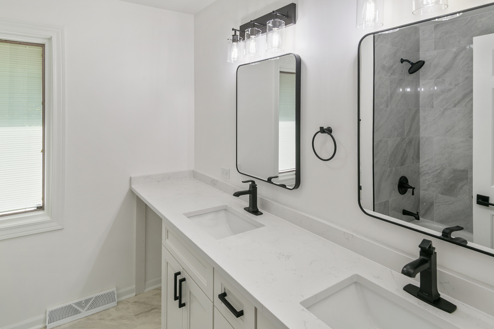 185 Cold Spring Road Barrington, IL 60010 - Photo 16 of 40 a bathroom with a sink and mirror