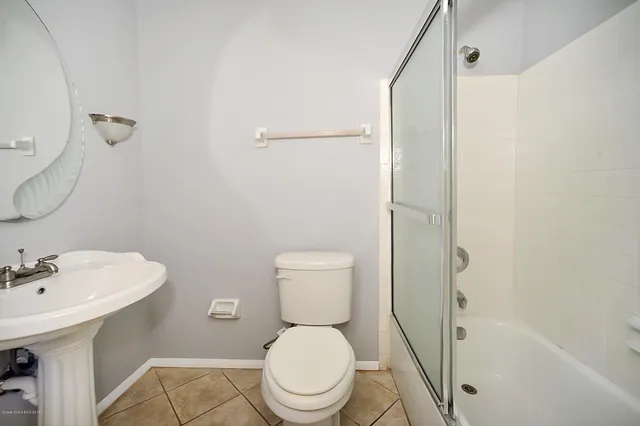 a view of a lake with a house in the background