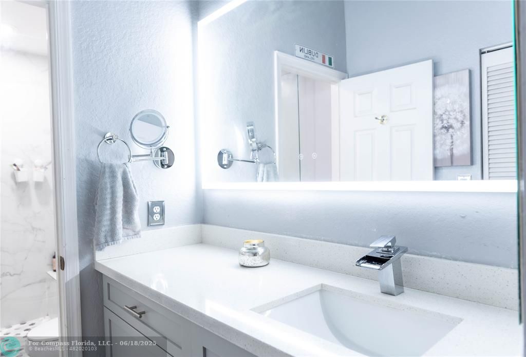 1102 Southwest 158th Avenue Pembroke Pines, FL 33027 - Photo 12 of 27 a bathroom with a sink and a mirror