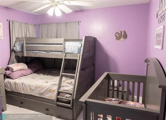 a view of bedroom with furniture and wooden floor