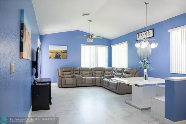 a living room with furniture and window