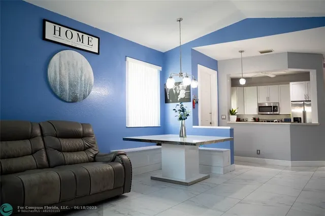 a living room with granite countertop furniture and a view of living room