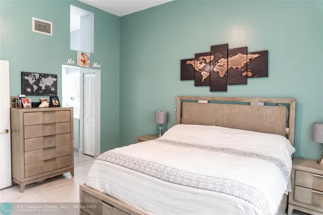 a bedroom with a bed and dresser