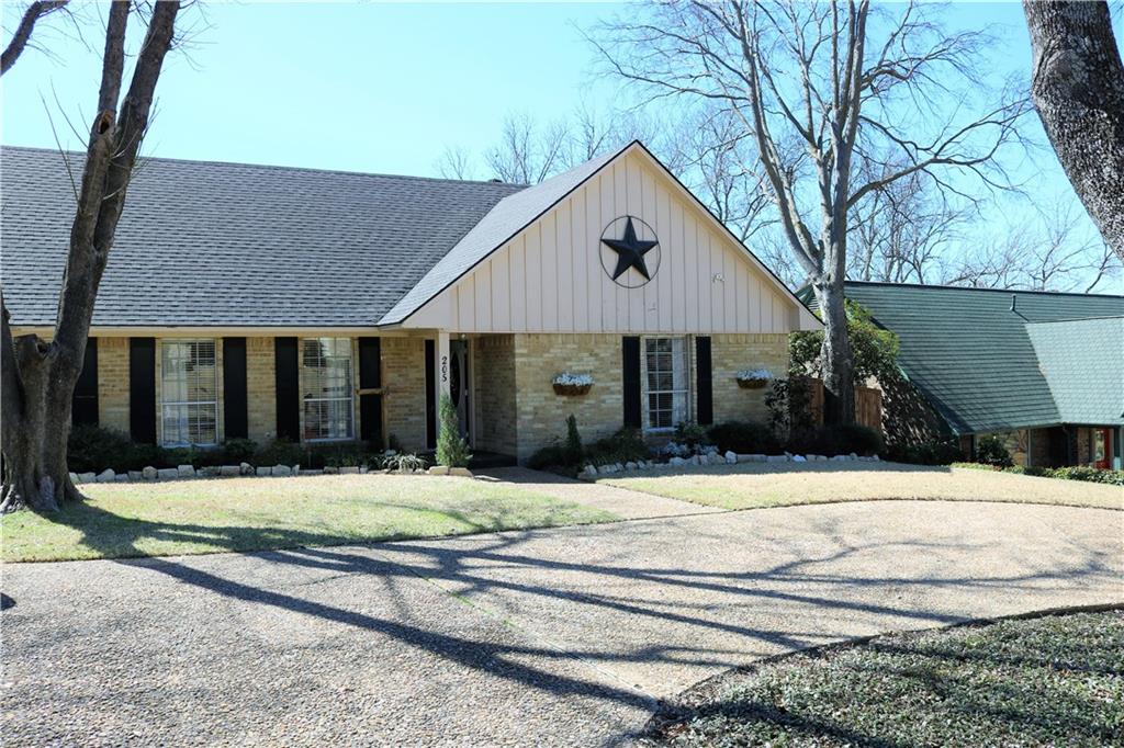 205 Summit Ridge Drive Rockwall, TX 75087 - Photo 1 of 1 a house that has a tree in front of it