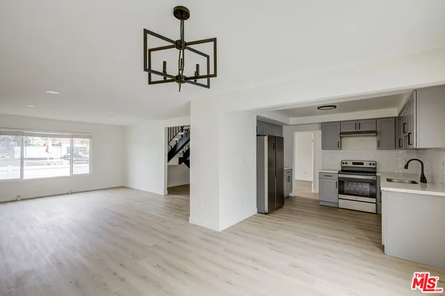 a view of a room with gym equipment and windows