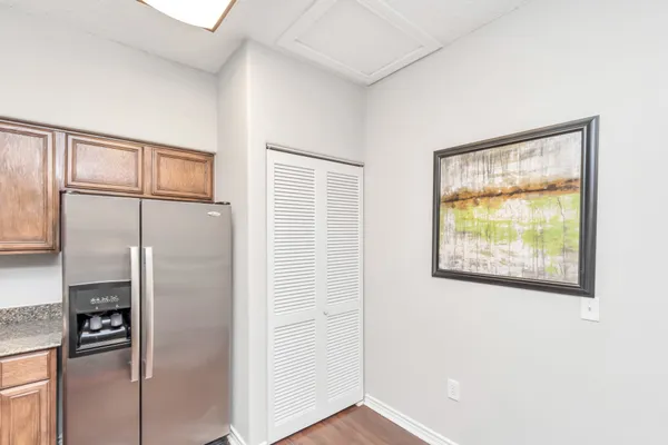 a kitchen with a refrigerator and a window