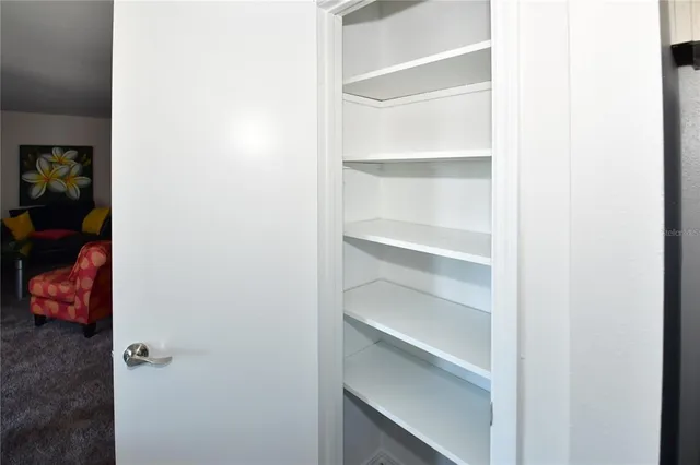 a view of a bathroom with a shower and a door