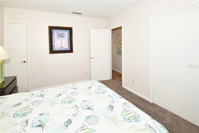 a bathroom with a sink a toilet and shower curtain