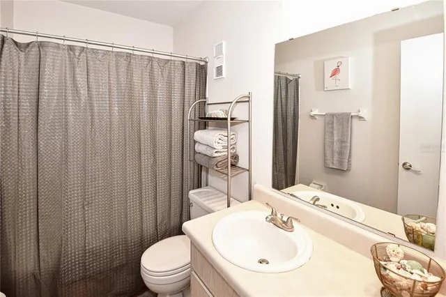 a bedroom with a bed and chair