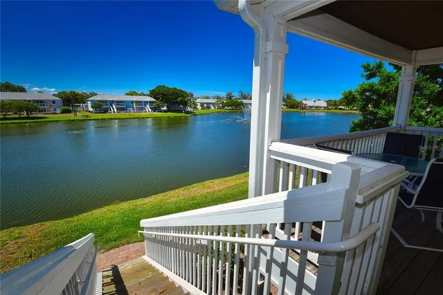 swimming pool view with a seating space