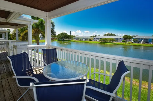 a view of a lake with houses in the back