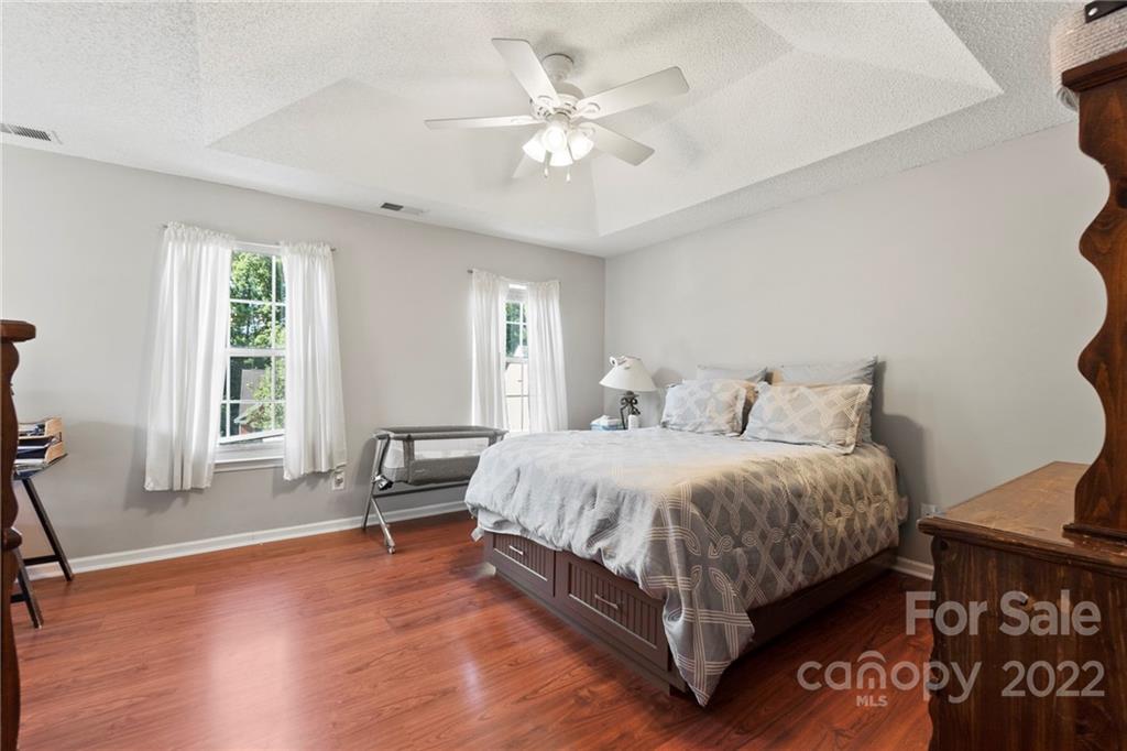 420 Wrayhill Drive Charlotte, NC 28262 - Photo 12 of 22 a spacious bedroom with a bed and a chair