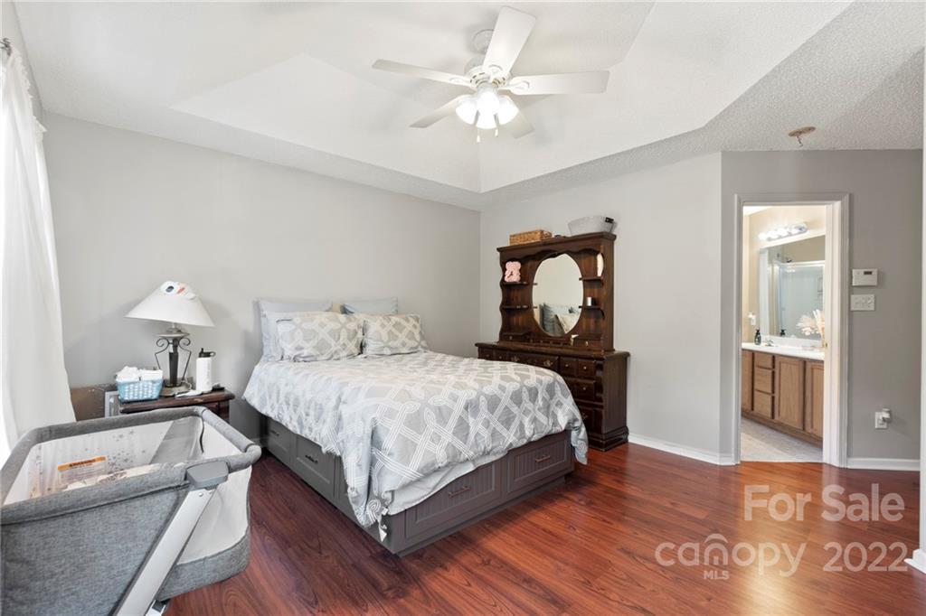 420 Wrayhill Drive Charlotte, NC 28262 - Photo 14 of 22 a bedroom with a bed a window and flowerpot