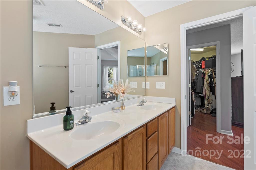 420 Wrayhill Drive Charlotte, NC 28262 - Photo 16 of 22 a bathroom with a sink and a mirror