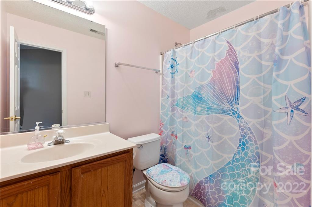 420 Wrayhill Drive Charlotte, NC 28262 - Photo 20 of 22 a bathroom with a sink toilet and shower