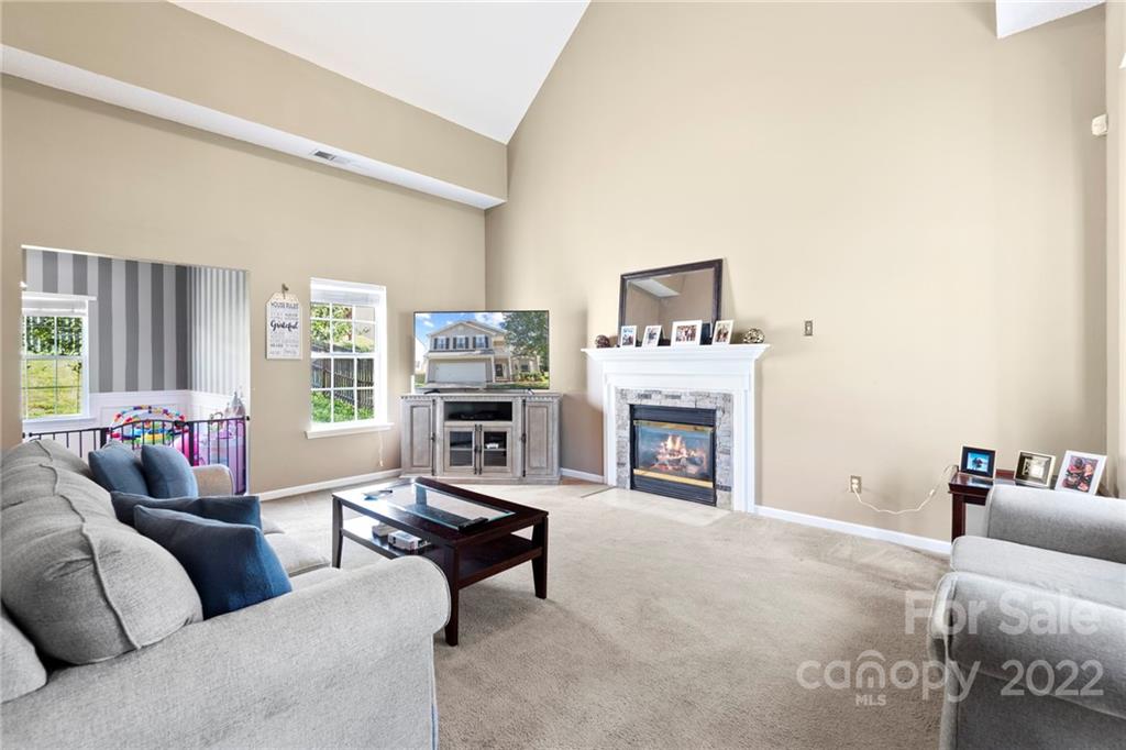 420 Wrayhill Drive Charlotte, NC 28262 - Photo 2 of 22 a living room with furniture and a fireplace