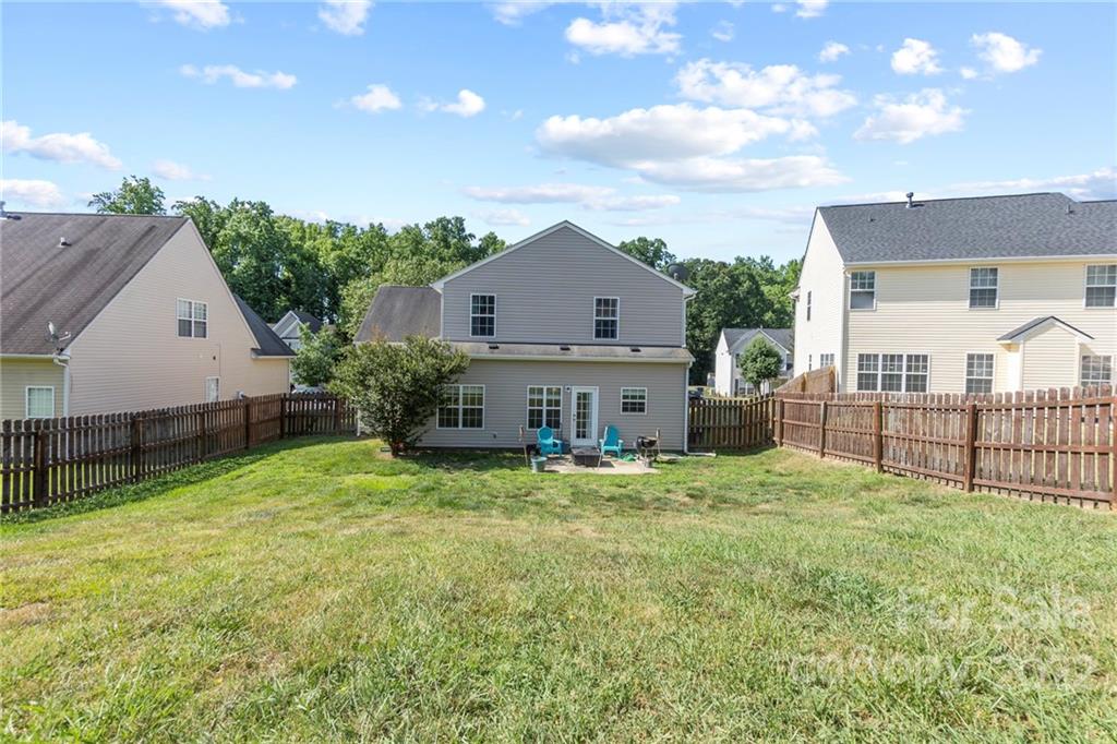 420 Wrayhill Drive Charlotte, NC 28262 - Photo 22 of 22 a view of a house with a yard and a wooden fence
