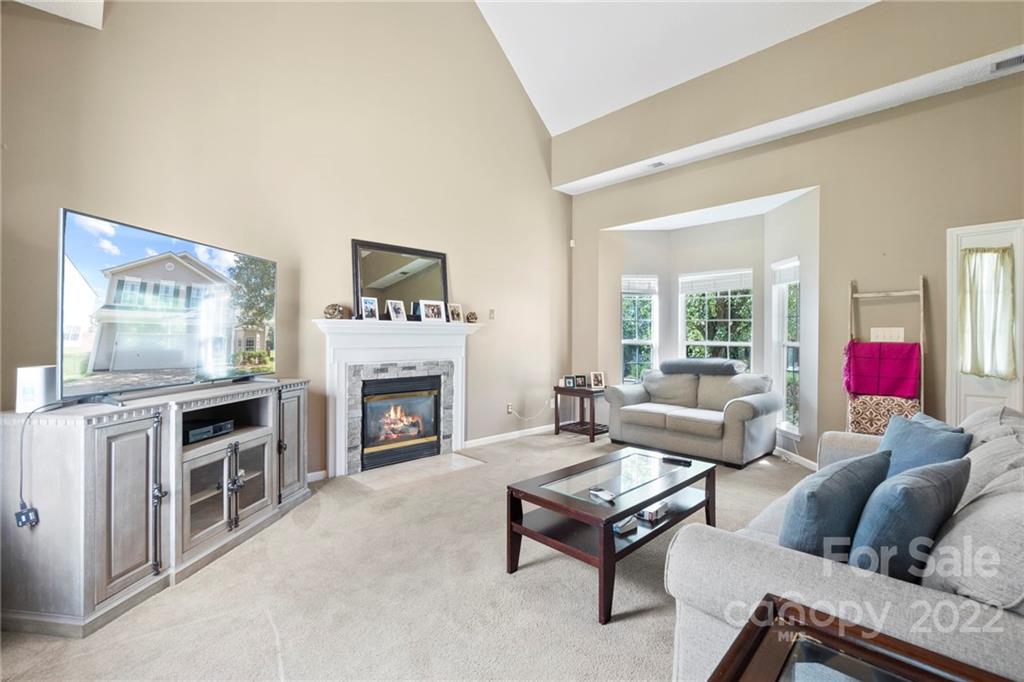 420 Wrayhill Drive Charlotte, NC 28262 - Photo 3 of 22 a living room with furniture and a fireplace
