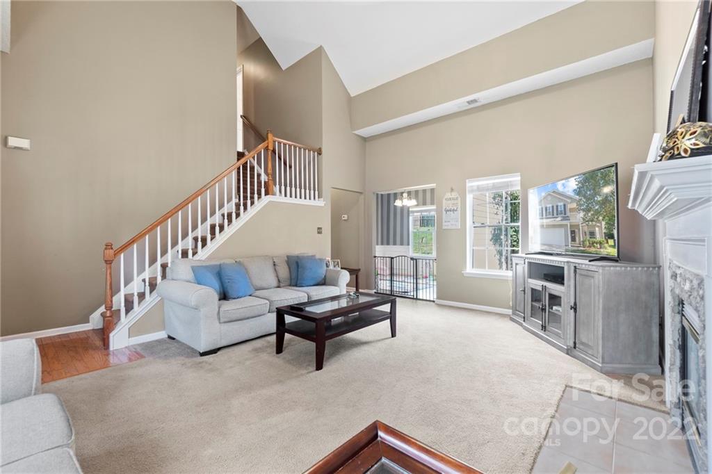 420 Wrayhill Drive Charlotte, NC 28262 - Photo 5 of 22 a living room with furniture and a fireplace