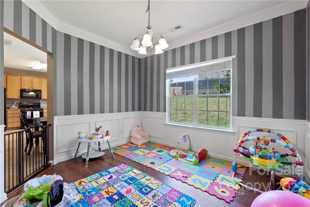 420 Wrayhill Drive Charlotte, NC 28262 - Photo 6 of 22 a bedroom that has a bed and a window in it