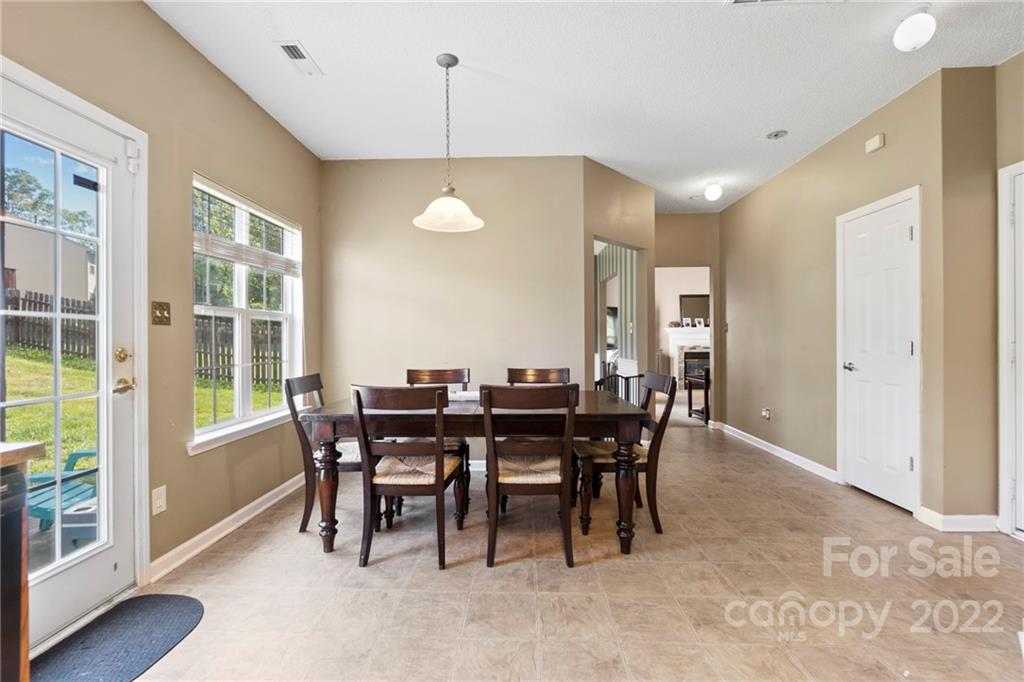 420 Wrayhill Drive Charlotte, NC 28262 - Photo 8 of 22 a view of a dining room with furniture window and wooden floor