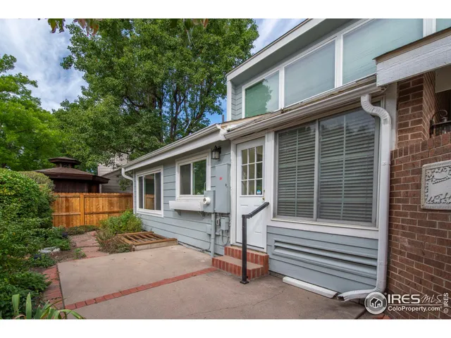 a backyard of a house with seating space