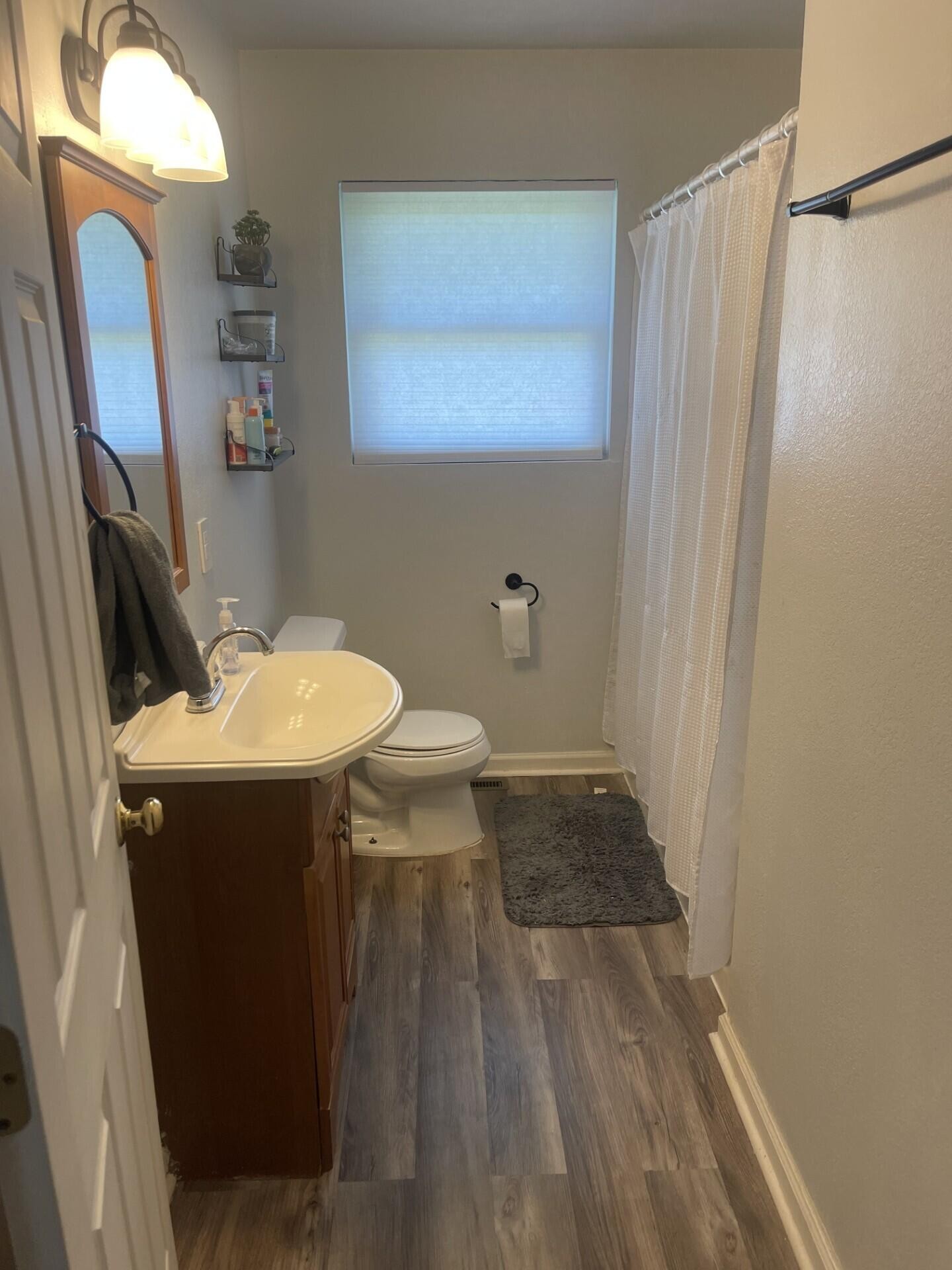 1239 Dossett Street Athens, TN 37303 - Photo 6 of 11 a bathroom with a sink and mirror