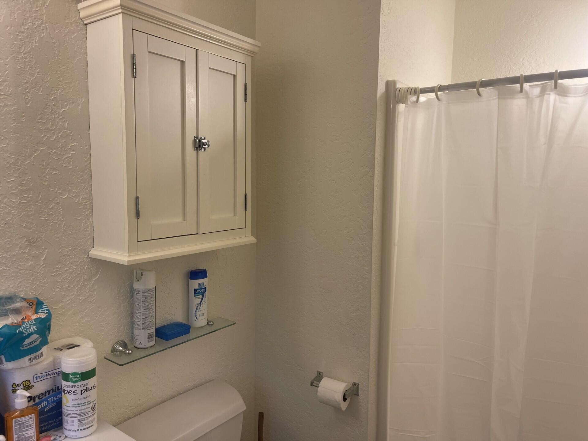 1239 Dossett Street Athens, TN 37303 - Photo 7 of 11 a bathroom with a shower curtain