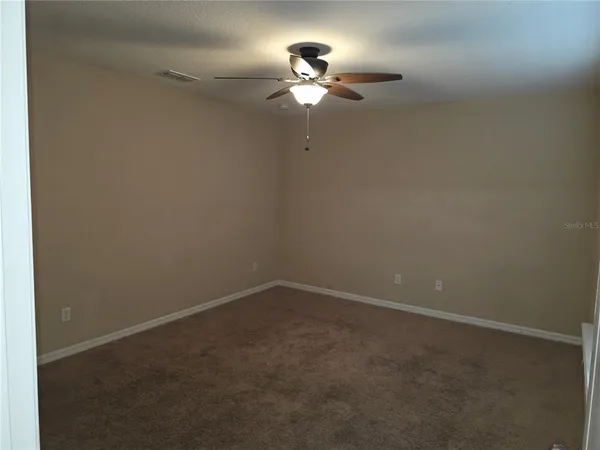 a view of a room with a fan
