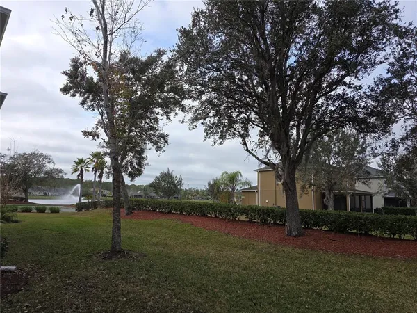 a view of lake with green space