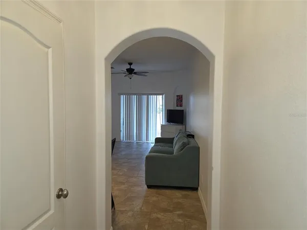 a living room with furniture and a window