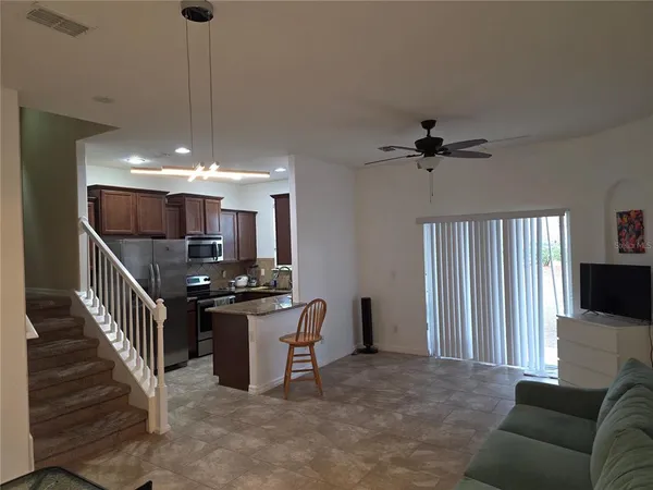 a view of a livingroom with furniture and windows