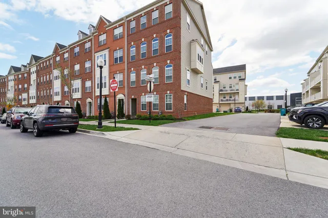 a building with car parked in front of it