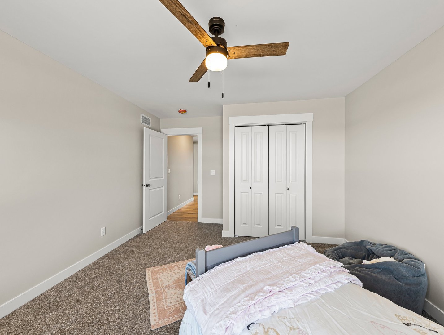 1927 Parkside Drive Sycamore, IL 60178 - Photo 12 of 17 a bedroom with a bed and a chandelier fan