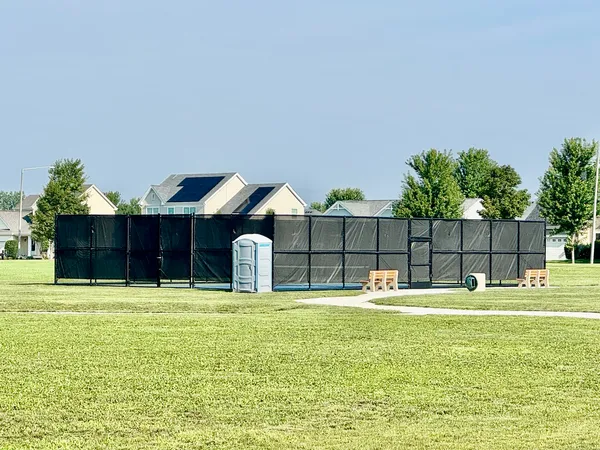 a house view with a sitting space and garden